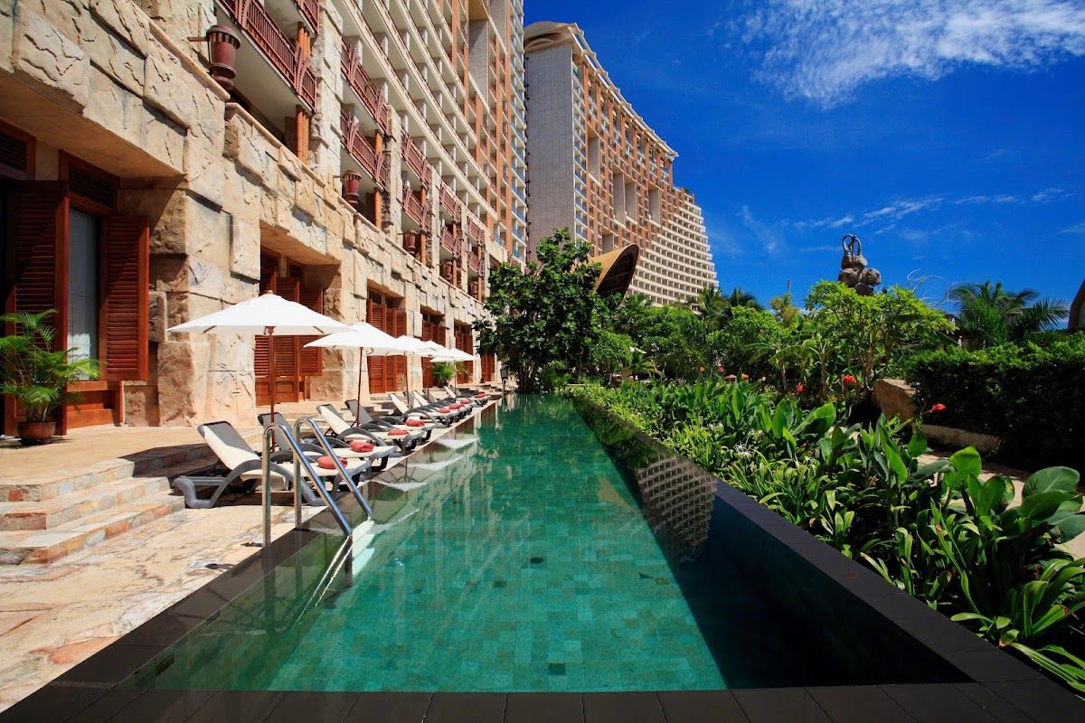 Centara Grand Mirage Beach Resort Pattaya — the pool and waterfall complex at Wongamat with tropical landscaping and beach access in the background