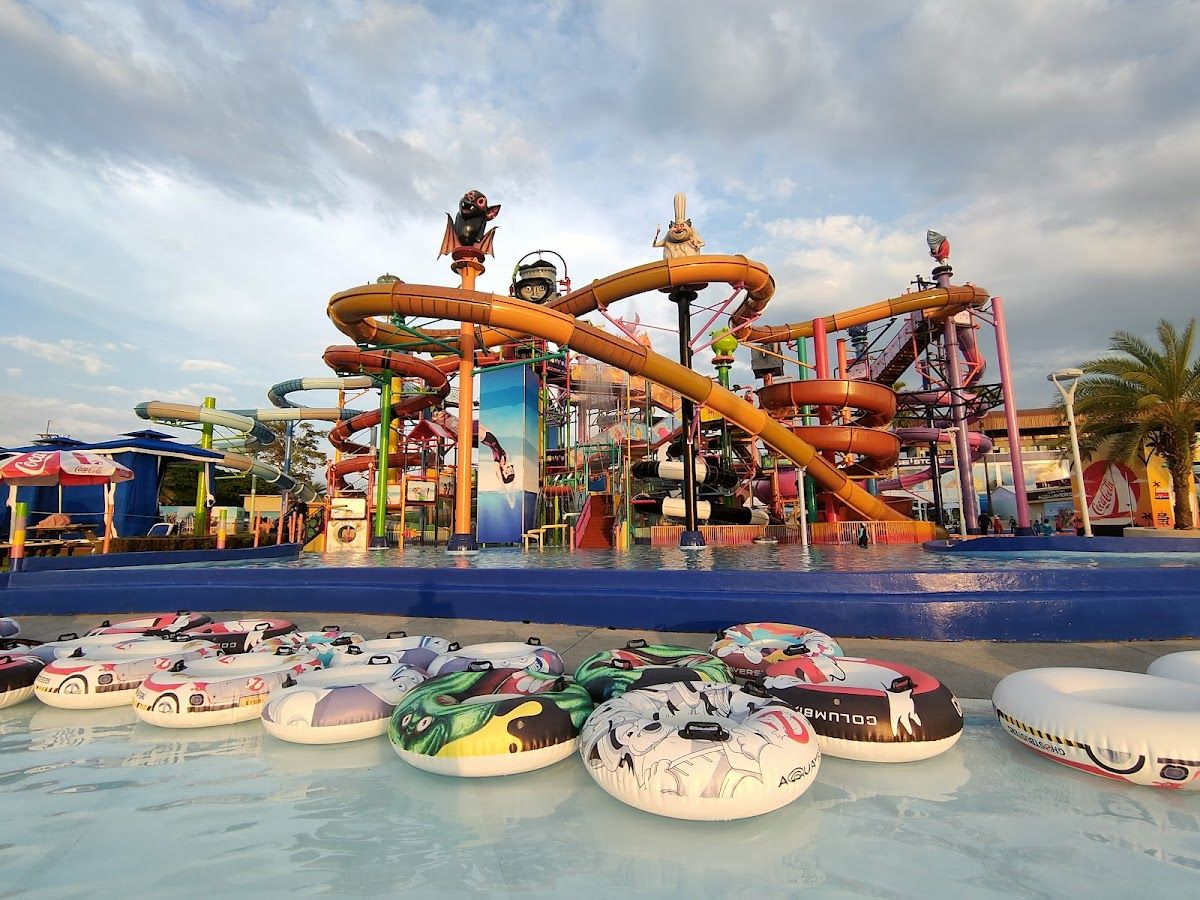 Colourful water slides and floating ring tubes at Columbia Pictures Aquaverse water park near Pattaya, Thailand
