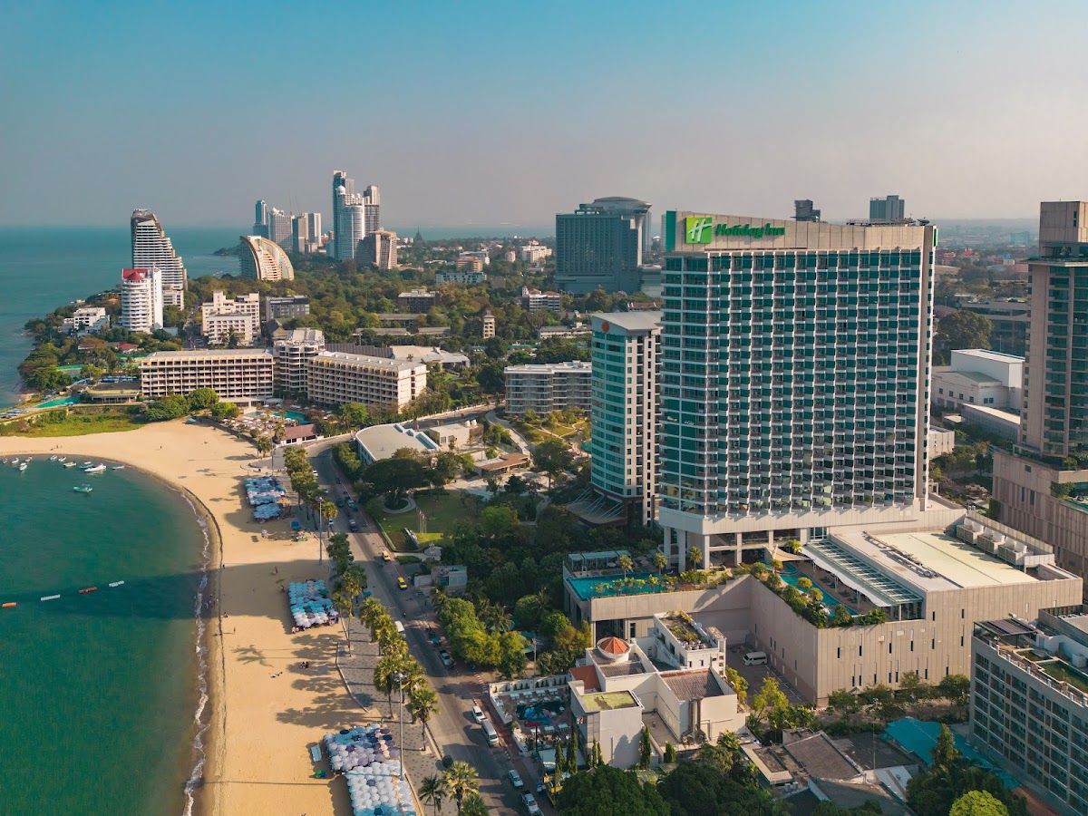 Holiday Inn Pattaya aerial view of the hotel tower on Beach Road with Pattaya Bay in the background