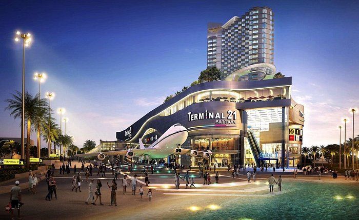 Multi-level interior of Terminal 21 Pattaya with escalators, international shops and restaurants across several floors