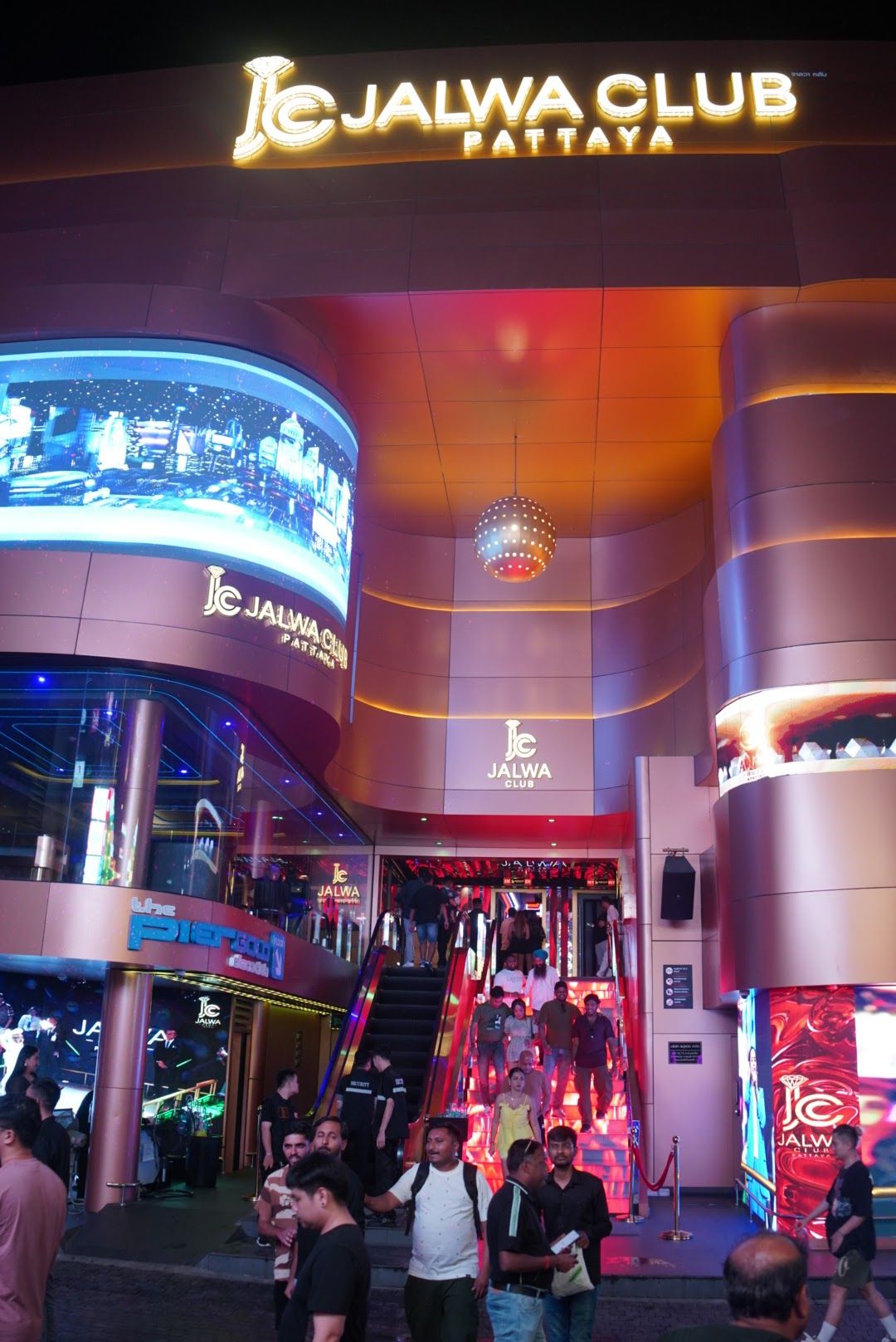 Walking Street Pattaya at night — the main go-go bar strip where bar fines are common